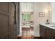 Hallway with built in wine storage and views of a breakfast nook at 927 Berkshire Ne Rd, Atlanta, GA 30324