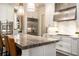 Elegant kitchen featuring custom cabinetry, marble countertops, and stainless appliances at 927 Berkshire Ne Rd, Atlanta, GA 30324