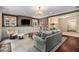 Inviting living room features built-in cabinetry, a fireplace, and comfortable seating arrangements at 927 Berkshire Ne Rd, Atlanta, GA 30324
