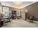 Cozy office with a large desk, bookshelves, and natural light from the windows at 927 Berkshire Ne Rd, Atlanta, GA 30324