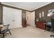 Comfortable office area featuring custom drawer storage, neutral carpet, and a workspace at 927 Berkshire Ne Rd, Atlanta, GA 30324