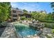 Amazing backyard featuring a pool, a stone patio, and lush landscaping for outdoor living at 927 Berkshire Ne Rd, Atlanta, GA 30324