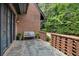 Charming brick porch with a stone floor and a comfortable seating area to enjoy the outdoors at 927 Berkshire Ne Rd, Atlanta, GA 30324