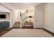 Bright foyer with an elegant staircase, hardwood floors, and access to the lower level at 927 Berkshire Ne Rd, Atlanta, GA 30324