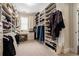 Extensive walk-in closet features custom shelving, ample storage for clothing and shoes, and natural lighting at 927 Berkshire Ne Rd, Atlanta, GA 30324