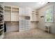 Spacious walk-in closet with custom shelving and storage at 927 Berkshire Ne Rd, Atlanta, GA 30324