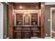 Beautifully designed wet bar with custom cabinetry, a countertop, and seating for entertaining at 927 Berkshire Ne Rd, Atlanta, GA 30324