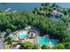 Overhead view of a community pool, trees, and waterfront access offering various amenities at 1010 Graystone Xing, Alpharetta, GA 30005