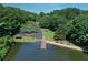 Picturesque waterfront scene featuring a wooden dock, lake access, picnic shelter, and serene ambiance at 1010 Graystone Xing, Alpharetta, GA 30005