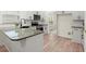 Bright kitchen with granite countertops, island sink, and modern appliances at 1010 Graystone Xing, Alpharetta, GA 30005