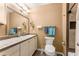 Well-lit bathroom with a single sink vanity, mirror, and a shower-tub combination at 212 Postell Rd, Dallas, GA 30157