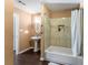 Bathroom featuring a pedestal sink and a tiled shower-tub combination at 212 Postell Rd, Dallas, GA 30157