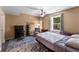 Well-lit bedroom featuring a bed, desk, and comfortable seating, creating a functional and cozy space at 212 Postell Rd, Dallas, GA 30157