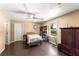 Bedroom with hardwood floors, a ceiling fan, and a built-in bookcase at 212 Postell Rd, Dallas, GA 30157