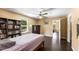 Spacious bedroom with a ceiling fan, ample natural light, and hardwood flooring at 212 Postell Rd, Dallas, GA 30157