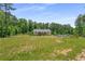 Charming single-story home set back from the road, surrounded by mature trees and a sprawling front yard at 212 Postell Rd, Dallas, GA 30157