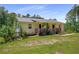 Charming single-story home with a wooden porch and well-maintained landscaping at 212 Postell Rd, Dallas, GA 30157
