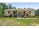 Charming single story home with covered porch and colorful flower garden at 212 Postell Rd, Dallas, GA 30157