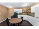 Kitchen featuring white cabinetry, open shelving, and a breakfast table at 212 Postell Rd, Dallas, GA 30157
