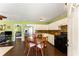 An open kitchen featuring white cabinets and stainless steel appliances with wood table at 212 Postell Rd, Dallas, GA 30157