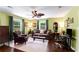 Cozy living room area with large windows, plush sofa and office setup area at 212 Postell Rd, Dallas, GA 30157