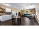 Open concept living space with a kitchen, table, and a comfortable seating area at 212 Postell Rd, Dallas, GA 30157