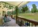 A quaint and relaxing porch with lovely flowers and seating to enjoy the outdoors at 212 Postell Rd, Dallas, GA 30157