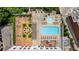 Aerial view showcasing pool, spa, lounging, dining, outdoor fire pit, and immaculate landscaping at 2277 Peachtree Ne Rd # 611, Atlanta, GA 30309