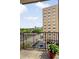 View from balcony showing surrounding buildings and city skyline beyond trees at 2277 Peachtree Ne Rd # 611, Atlanta, GA 30309