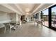 Bright community room with herringbone floors, tables, and outdoor seating nearby at 2277 Peachtree Ne Rd # 611, Atlanta, GA 30309