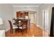 Open-concept dining area with hardwood floors, stylish furniture, and a view of the kitchen at 2277 Peachtree Ne Rd # 611, Atlanta, GA 30309