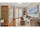 Bright living room featuring hardwood floors, a balcony, neutral tones and an oversized cabinet at 2277 Peachtree Ne Rd # 611, Atlanta, GA 30309