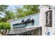 ChopShop restaurant's exterior showcases a blue facade and an inviting, bright space with large storefront windows at 2277 Peachtree Ne Rd # 611, Atlanta, GA 30309