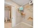 Walk-in closet with wire shelving for organizing clothes and accessories adjacent to the bathroom at 2277 Peachtree Ne Rd # 611, Atlanta, GA 30309