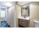 The bathroom has a modern vanity with drawers, a mirror, and a shower with a curtain at 3091 Colonial Way # I2, Atlanta, GA 30341
