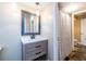 Bathroom featuring modern vanity, storage and mirror, along with tub and shower at 3091 Colonial Way # I2, Atlanta, GA 30341