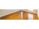 Bedroom with hardwood floor, white trim, and multiple windows at 3091 Colonial Way # I2, Atlanta, GA 30341
