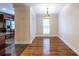 Dining room with hardwood floors, a pendant light fixture, and a view of the kitchen area at 3091 Colonial Way # I2, Atlanta, GA 30341