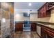 This kitchen features granite countertops, tile floors, and stainless steel appliances at 3091 Colonial Way # I2, Atlanta, GA 30341
