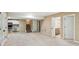 Open basement with a kitchen, carpeted floors, stairs, and two doors at 4217 Wieuca Overlook Ne, Atlanta, GA 30342