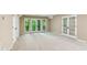 Open carpeted basement with french doors leading to outdoor scenery and a closet at 4217 Wieuca Overlook Ne, Atlanta, GA 30342