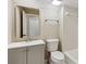 Bathroom with a white toilet and a grey vanity with a mirror reflecting the toilet and an open closet at 4217 Wieuca Overlook Ne, Atlanta, GA 30342