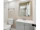 Bathroom with a white toilet and grey vanity with mirror reflecting the toilet and a towel rack at 4217 Wieuca Overlook Ne, Atlanta, GA 30342