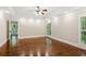 Spacious bedroom boasts hardwood floors, tray ceiling, and natural light from the large windows at 4217 Wieuca Overlook Ne, Atlanta, GA 30342