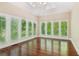 Sunlit bonus room with hardwood floors and plantation shutters at 4217 Wieuca Overlook Ne, Atlanta, GA 30342