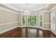 Light-filled dining room features hardwood floors, chandelier, and many windows at 4217 Wieuca Overlook Ne, Atlanta, GA 30342