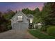 Charming two-story home with a balcony, two-car garage, and landscaped front yard at 4217 Wieuca Overlook Ne, Atlanta, GA 30342