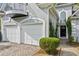 Close up of the home's front exterior with a two-car garage and a black front door at 4217 Wieuca Overlook Ne, Atlanta, GA 30342