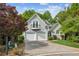 Charming two-story home with a balcony, two-car garage, and landscaped front yard at 4217 Wieuca Overlook Ne, Atlanta, GA 30342