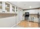 Modern kitchen with stainless steel appliances and white cabinetry, with open and closed storage at 4217 Wieuca Overlook Ne, Atlanta, GA 30342